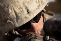 Lance Cpl. Dustin Dodd, a Habersham, Ga., native and turret gunner with Combat Logistics Regiment 2, Regional Command (Southwest), looks through the sights on his machine gun during a combat logistics patrol in Helmand province, Afghanistan, Aug. 28, 2013. Dodd commonly stands in the turret for more than eight consecutive hours at a time on convoys that can last for days.
