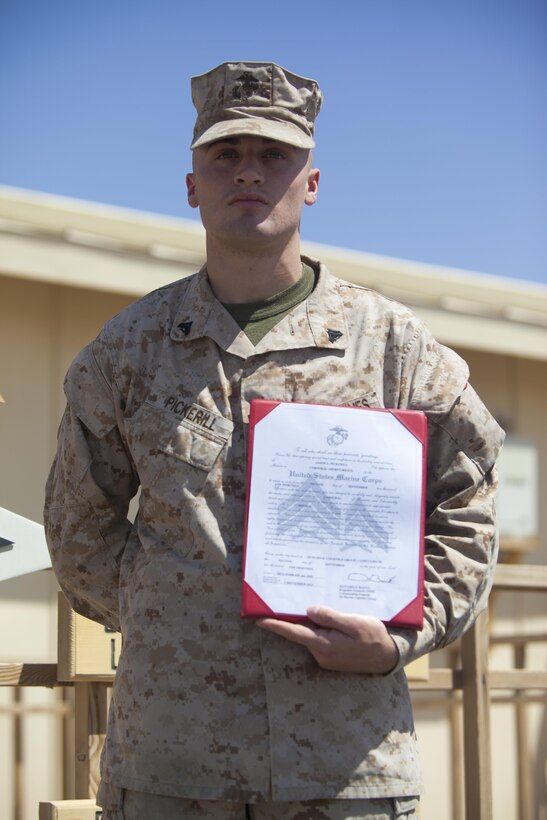 Cpl. Jason Pickerill, an Evansville, Ind., native and computer technician with Combat Logistics Regiment 2, Regional Command (Southwest), pins on the rank of corporal at Camp Leatherneck, Afghanistan, Sept. 2, 2013. Pickerill received his promotion meritoriously after competing against a board of his peers.