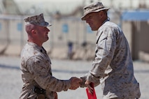 U.S. Marine Staff Sgt. Zane Moorman, a Radio Chief with Headquarters and Service Company, Combat Logistics Regiment 2, Regional Command (Southwest), reenlists on Camp Leatherneck, Helmand province, Afghanistan, September 2, 2013. Moorman, a Tifton, Georgia native , has been in the Marine Corps for eight years. (U.S. Marine Corps photo by Sgt. Anthony L. Ortiz / Released)     