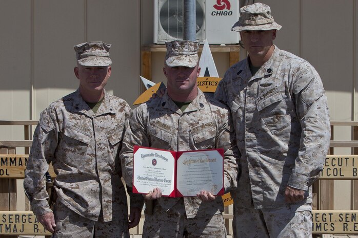 U.S. Marine Staff Sgt. Zane Moorman, a Radio Chief with Headquarters and Service Company, Combat Logistics Regiment 2, Regional Command (Southwest), reenlists on Camp Leatherneck, Helmand province, Afghanistan, September 2, 2013. Moorman, a Tifton, Georgia native , has been in the Marine Corps for eight years. (U.S. Marine Corps photo by Sgt. Anthony L. Ortiz / Released)     