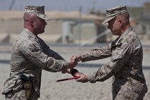 U.S. Marine Staff Sgt. Zane Moorman, a Radio Chief with Headquarters and Service Company, Combat Logistics Regiment 2, Regional Command (Southwest), reenlists on Camp Leatherneck, Helmand province, Afghanistan, September 2, 2013. Moorman, a Tifton, Georgia native , has been in the Marine Corps for eight years. (U.S. Marine Corps photo by Sgt. Anthony L. Ortiz / Released)     