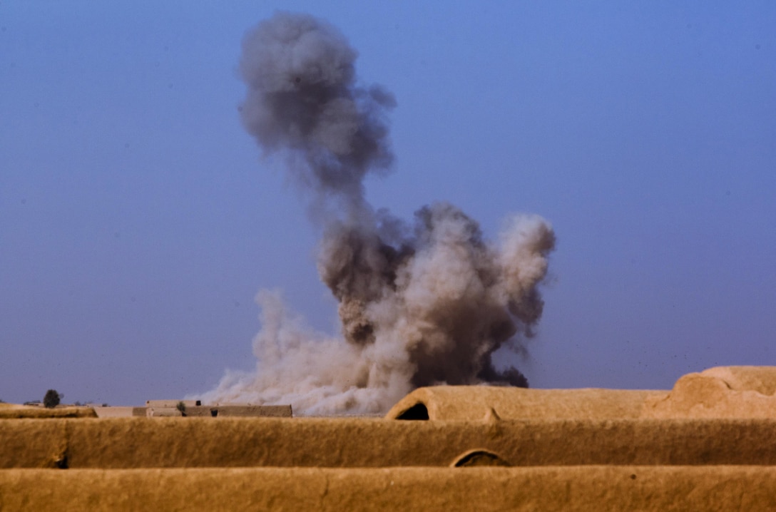 A mushroom cloud rises into the air following an airstrike on confirmed enemy positions during a patrol near Forward Operating Base Shir Ghazi, Helmand province, Afghanistan, Aug. 28, 2013. A nearby unit called in the airstrike while a convoy of Marines with Combat Logistics Regiment 2, Regional Command (Southwest), pushed north to conduct logistical operations.