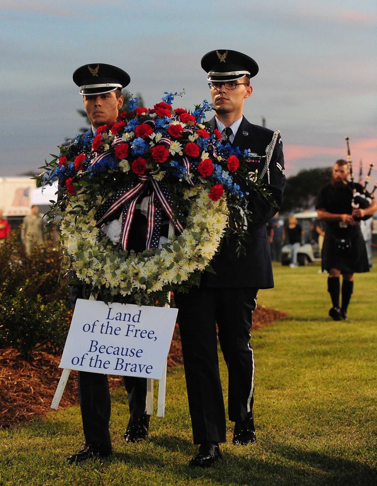 U.S. Air Force ceremonial guardsmen from the 509th Bomb Wing Honor Guard march to lay a wreath during the Vietnam Traveling Memorial Wall opening ceremony in Concordia, Mo., Sept. 4, 2013. The purpose of the event was to honor Service members who gave the ultimate sacrifice during the Vietnam War. (U.S. Air Force photo by Staff Sgt. Nick Wilson/Released)