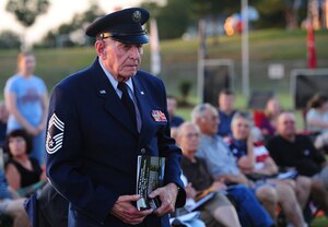 Retired U.S. Air Force Chief Master Sgt. Melvin Bockelman stands to be recognized as an Air Force veteran during the Vietnam Traveling Memorial Wall opening ceremony in Concordia, Mo., Sept. 4, 2013. Bockelman is a World War II veteran who served in the Air Force for 23 years. He enlisted into the Army Air Corps in 1944 and retired from the Air Force in 1967. (U.S. Air Force photo by Staff Sgt. Nick Wilson/Released)