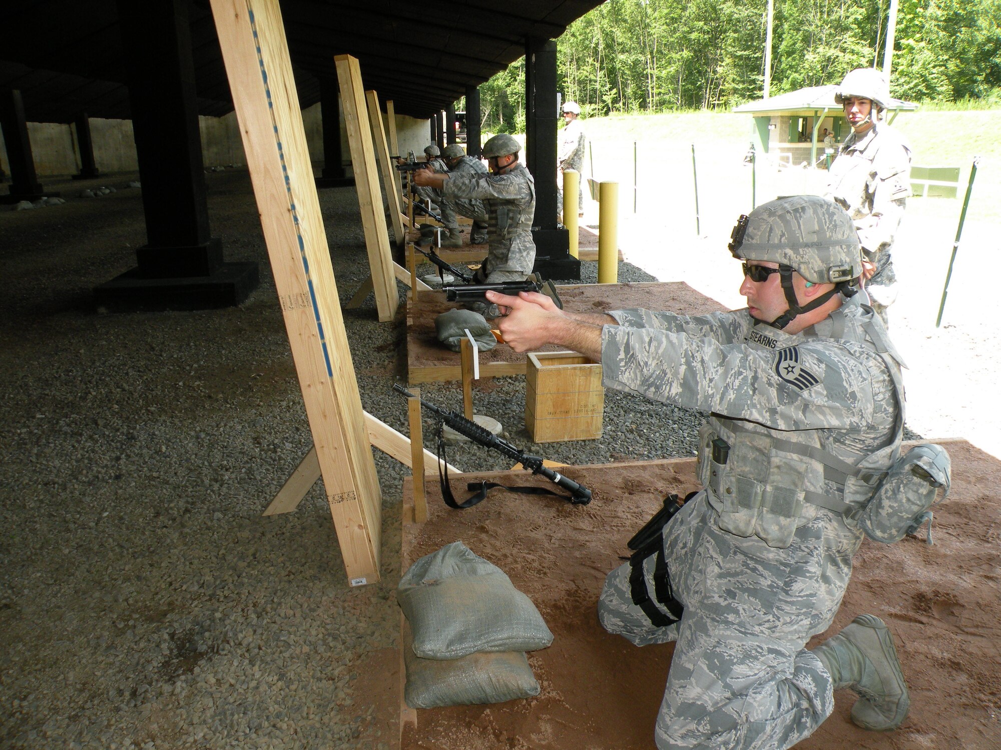 Staff. Sgt. Michael Stearns, 103rd Security Forces Squadron, takes aim during the Adjutant General’s marksmanship competition held at the East Haven, Conn., Rifle Range Aug. 2–4, 2013. The Connecticut Air National Guard Security Forces teams came in first and third place out of 11 teams, beating the lead Army National Guard team by more than 300 points.  (U.S. Air National Guard Photo by Tech. Sgt. Jessica Roy)