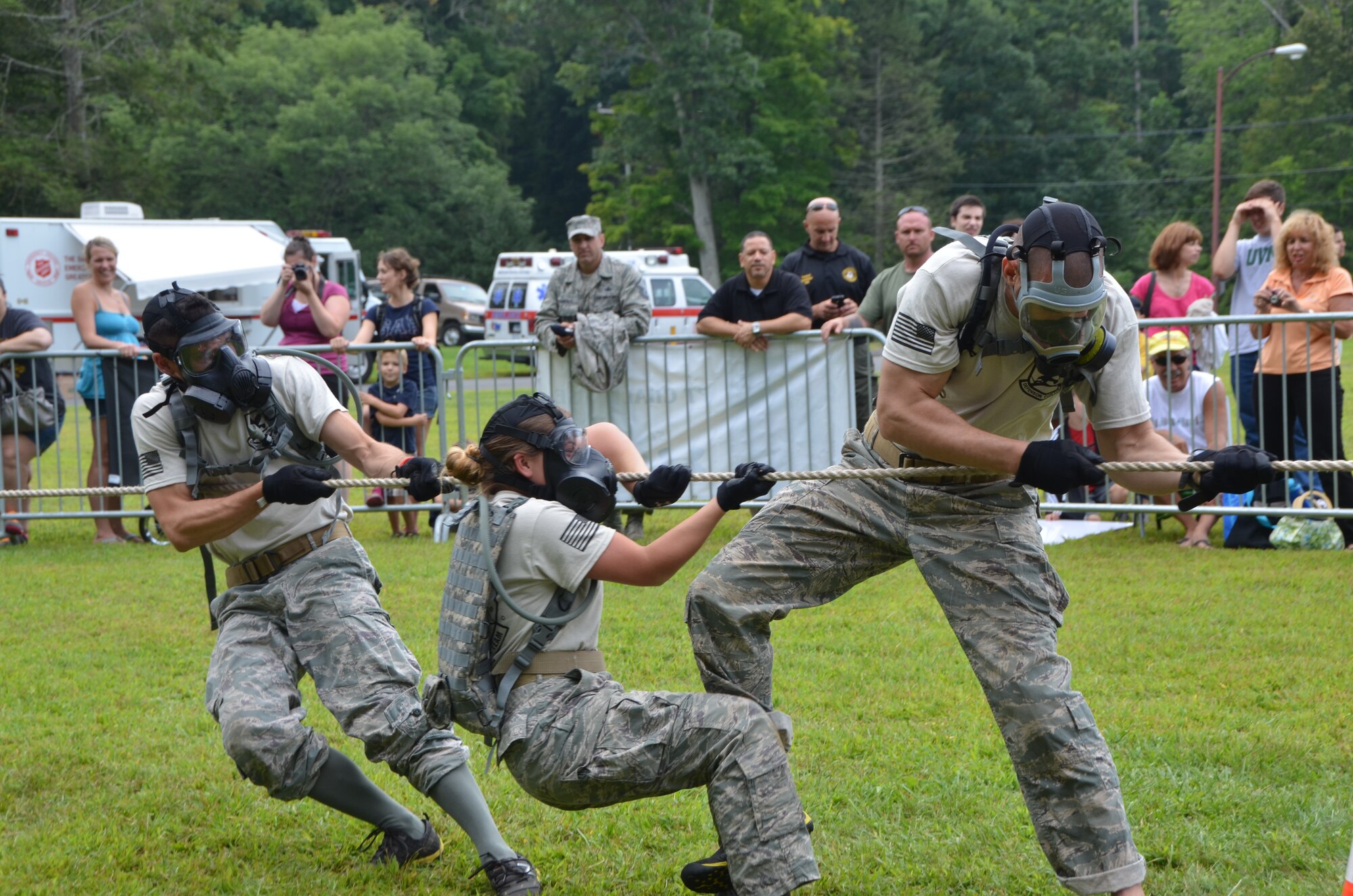 Members of the 103rd Security Forces Squadron emergency services team tug together as part of the Connecticut SWAT Challenge on Aug. 22, 2013, at the West Hartford Reservoir, West Hartford, Conn. The Connecticut Air National Guard team grabbed eighth place overall, besting 20 other regional teams. This was just one of many physically grueling obstacles competitors faced.  (U.S. Air National Guard Photo by Maj. Bryon Turner)