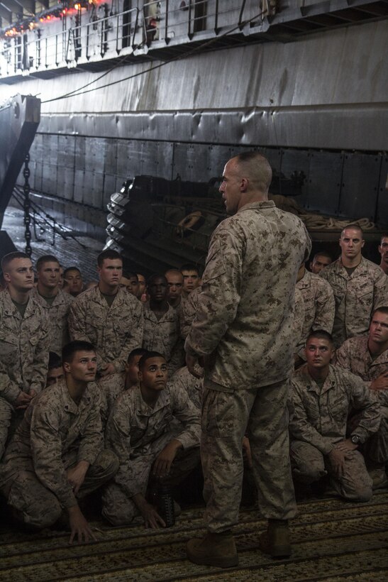 U.S. Marine Corps Lt. Col. Charles Cassidy, commander of Battalion Landing Team (BLT) 3/2, 26th Marine Expeditionary Unit (MEU), speaks to the Marines and Sailors of BLT 3/2 about future operations aboard the the USS Carter Hall (LSD 50), at sea, Sept. 3, 2013. The 26th MEU is a Marine Air-Ground Task Force forward deployed to the U.S. 5th Fleet area of responsibility aboard the Kearsarge Amphibious Ready Group serving as a sea-based, expeditionary crisis response force capable of conducting amphibious operations across the full range of military operations.
(U.S. Marine Corps photo by Cpl. Michael S. Lockett/Released)