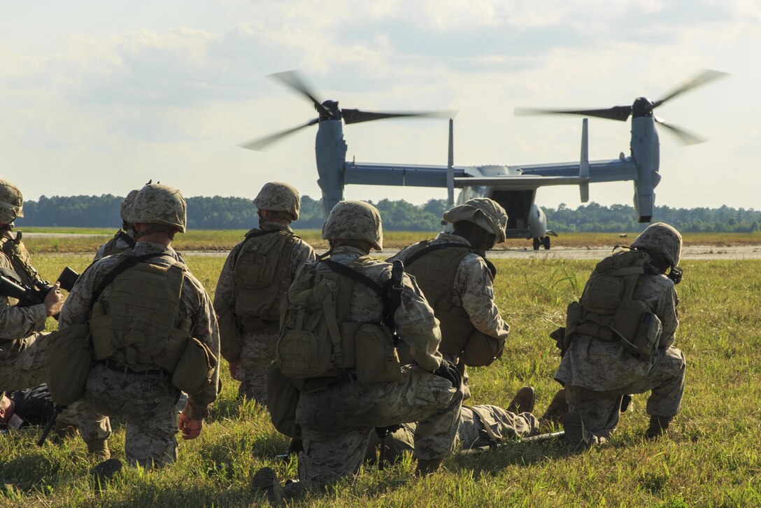 U.S. Marines and Navy corpsmen with Combat Logistics Battalion 22, 22nd Marine Expeditionary Unit (MEU), prepare to load a simulated casualty onto an MV-22 Osprey aircraft during a casualty evacuation drill as part of the MEU’s Realistic Urban Training exercise at Fort Pickett, Va., Aug. 30, 2013. During the drill, the Marines and Sailors learned how to insert by air, secure an area, triage the wounded and transport them to the nearest medical facility. The MEU is scheduled to deploy in early 2014 to the U.S. 5th and 6th Fleet areas of responsibility with the Bataan Amphibious Ready Group as a sea-based, expeditionary crisis response force capable of conducting amphibious missions across the full range of military operations. (U.S. Marine Corps photo by Cpl. Shawn Ponterio/Released)