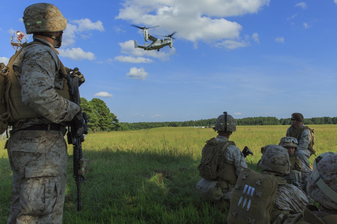 U.S. Marines and Navy corpsmen with Battalion Landing Team 1st Battalion, 6th Marine Regiment, 22nd Marine Expeditionary Unit (MEU), prepare to load an MV-22 Osprey aircraft during a casualty evacuation drill as part of the MEU’s Realistic Urban Training exercise at Fort Pickett, Va., Aug. 30, 2013. During the drill, the Marines and Sailors learned how to insert by air, secure an area, triage the wounded and transport them to the nearest medical facility. The MEU is scheduled to deploy in early 2014 to the U.S. 5th and 6th Fleet areas of responsibility with the Bataan Amphibious Ready Group as a sea-based, expeditionary crisis response force capable of conducting amphibious missions across the full range of military operations. (U.S. Marine Corps photo by Cpl. Manuel A. Estrada/Released)