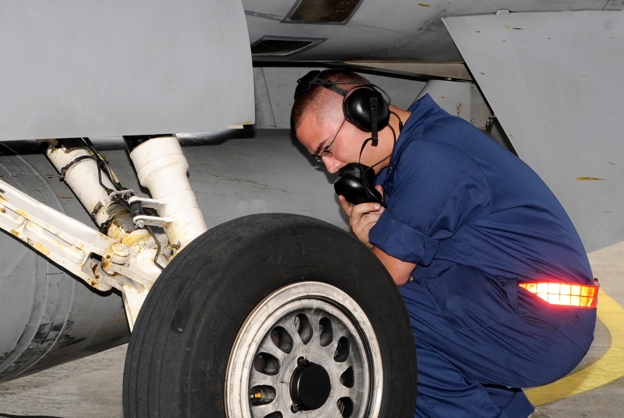 Senior Airman John Gunter, 35th Aircraft Maintenance Squadron crew chief, inspects an F-16 Fighting Falcon during exercise Iron Spear at Misawa Air Base, Japan, Sep. 5, 2013. The exercise is a semi-annual event that simulates pitting U.S. F-16 Fighting Falcons and Japanese Defense Forces Surface-to-Air Missile (SAM) systems against each other in order to improve both the skills and the quality of weapon systems and their operators; this helps ensure the forces are prepared for real-world missions. (U.S. Air Force photo by Airman 1st Class Kaleb Snay)