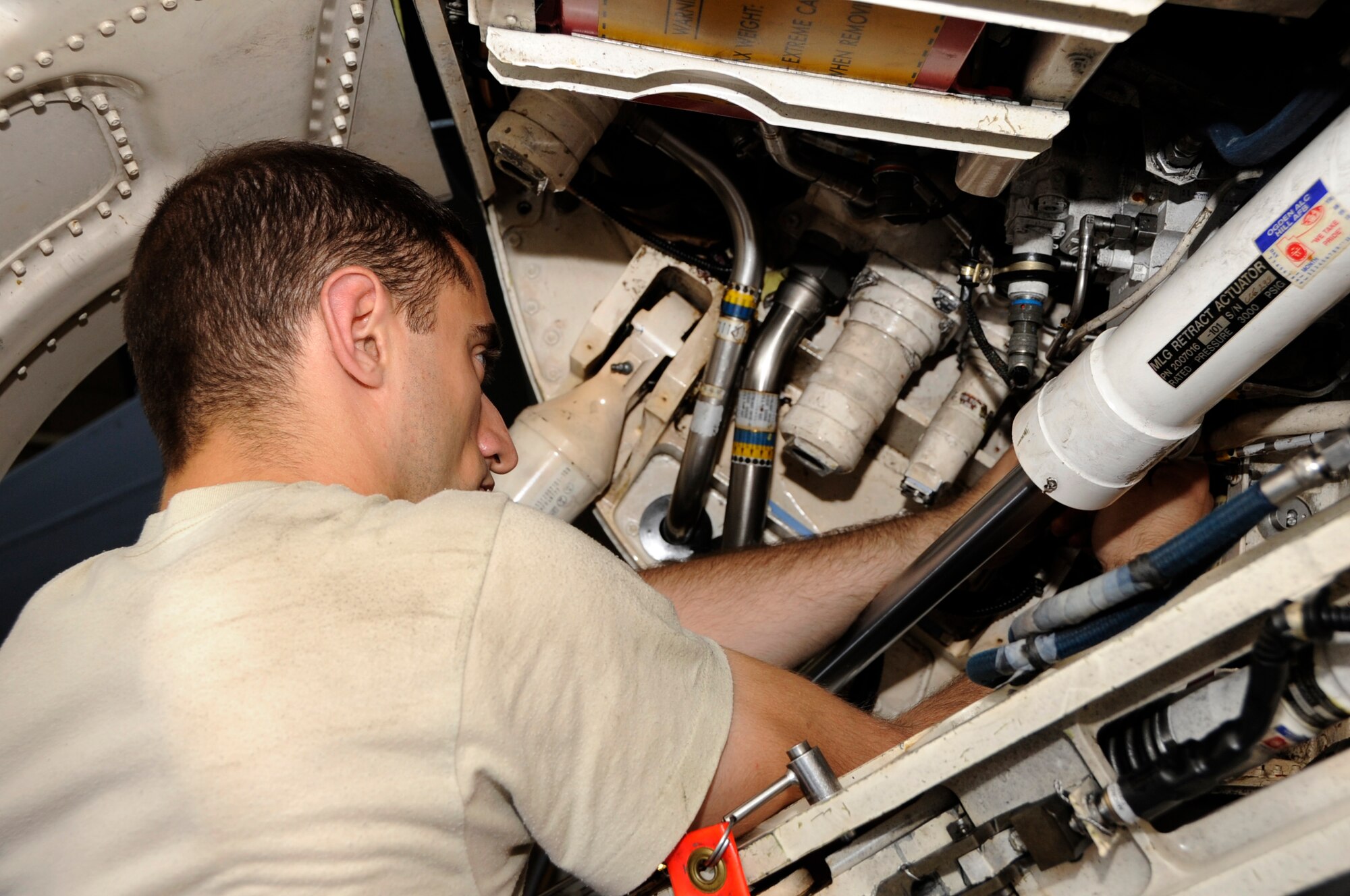 U.S. Air Force Staff Sgt. David Stricker, 35th Aircraft Maintenance Squadron electrical and environmental specialist, inspects an F-16 Fighting Falcon during bilateral exercise Iron Spear at Misawa Air Base, Japan, Sep. 5, 2013. Iron Spear allows both nations to validate tactics and training and improve upon deficiencies, preparing for any real-world crisis. (U.S. Air Force photo by Airman 1st Class Kaleb Snay)