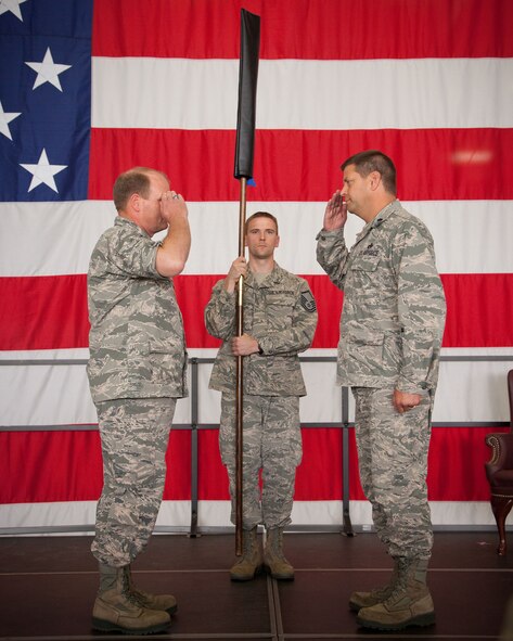 Col. Cam LeBlanc, 934th Maintenance Group commander, presides over the 934th Maintenance Operations Flight inactivation ceremony as the MOF flag is furled and Lt. Col. Marvin Schaitel, 934 MOF acting commander, relinquishes command.  (U.S. Air Force photo/Shannon McKay)