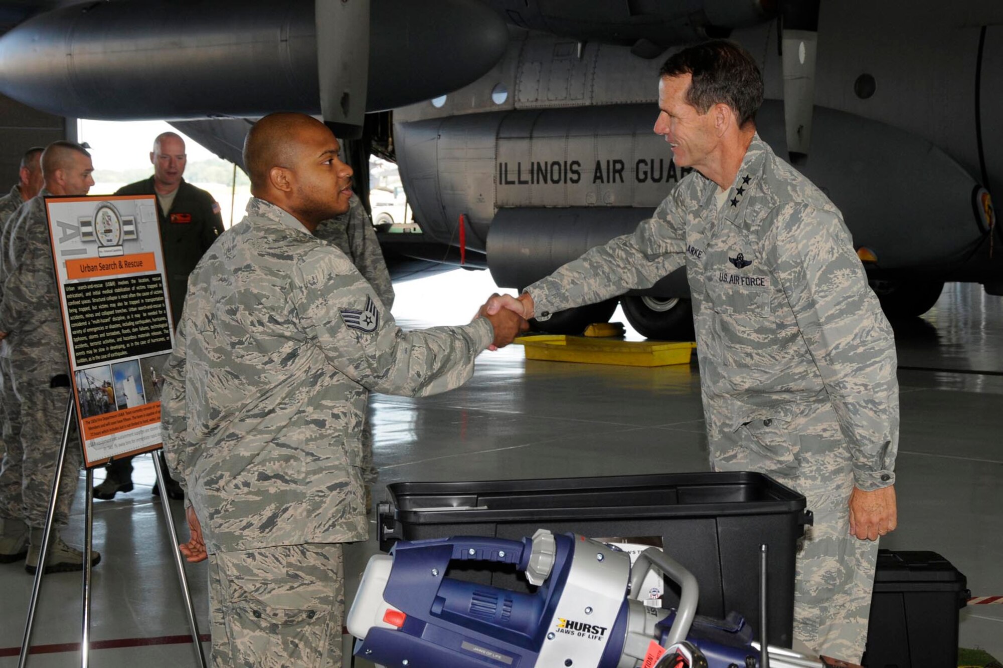 Lt. Gen. Stanley E. Clarke, Director of the Air National Guard, meets Staff Sgt. Brandon Johnson of the 182nd Civil Engineer Squadron to receive a briefing on Urban Search and Rescue equipment during a site visit at the182nd Airlift Wing in Peoria, Ill. Sep. 6, 2013.  (Air National Guard photo by Tech. Sgt. Todd Pendleton/released)
