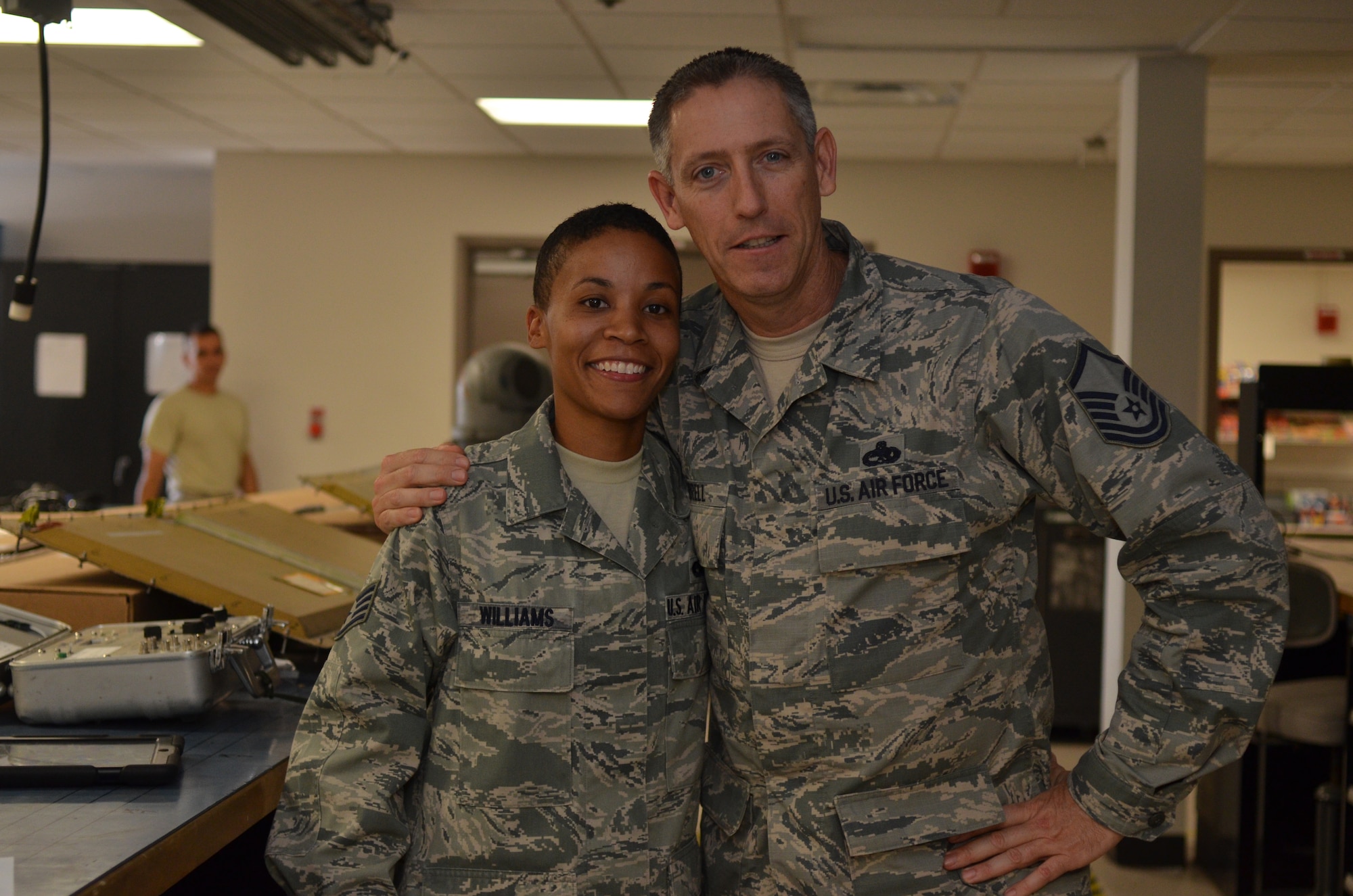 Staff Sgt. Jennafur Williams, integrated avionics guidance and control specialist, 920th Maintenance Squadron, (right) and Master Sgt. Larry Jarrell, avionics technician, pose during Williams last unit training assembly with the 920th Rescue Wing, Patrick Air Force Base, Fla. Jarrell was Williams training manager when she was on seasoning training orders in 2009. Williams became the wings first reservists to be awarded the John L. Levitow award after completing Airman Leadership School Aug. 29, 2013. (U.S. Air Force photo/Senior Airman Natasha Dowridge)