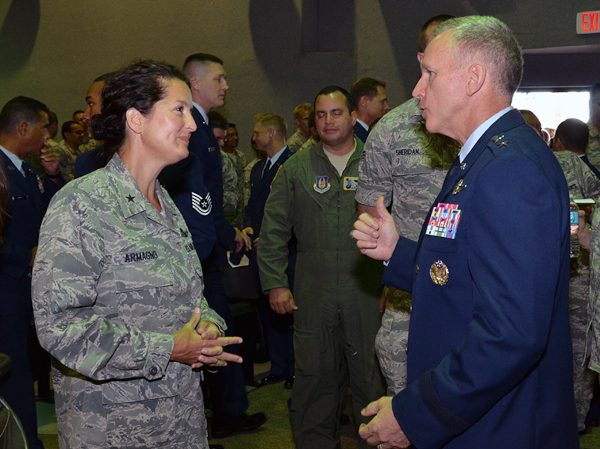 Maj. Gen. William Binger, 10th Air Force commander, talks with Brig. Gen. Nina Armagno, 45th Space Wing commander, after the 920th Rescue Wing commander’s call at Patrick Air Force Base, Fla., Sept. 8, 2013. (U.S. Air Force photo/Tech. Sgt. Anna-Marie Wyant)