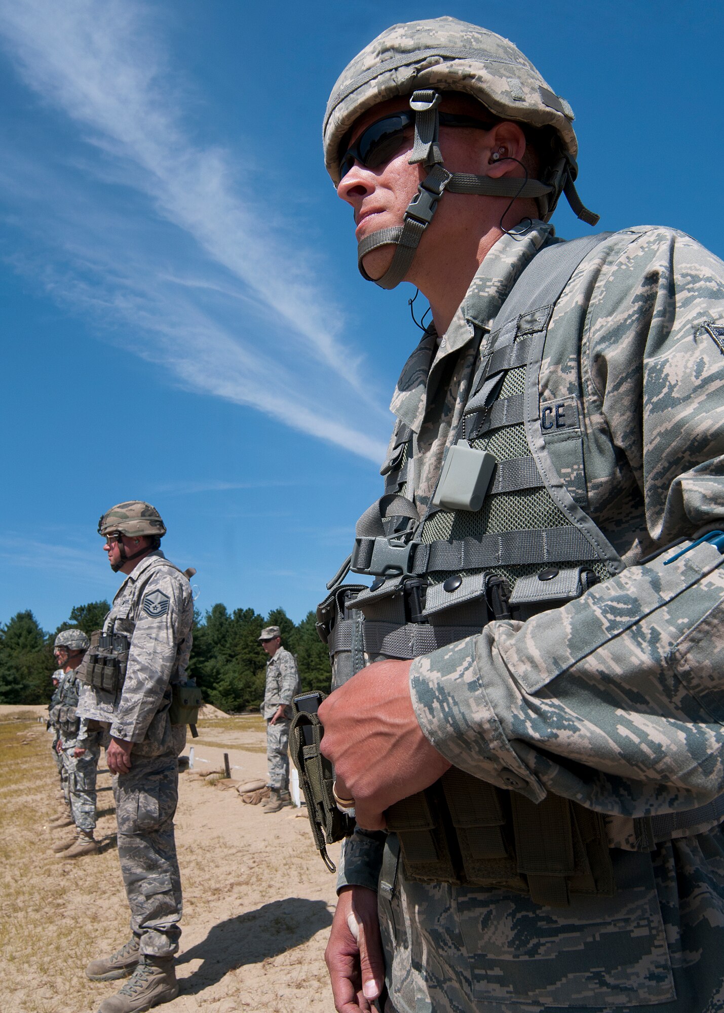 FORT DEVENS, Mass. – New Hampshire Air National Guard members, Senior Airman Nelson Elias, right, and Master Sgt. Michael Bane, prepare to fire the M-9 weapon during the pistol portion of the state marksmanship competition here Aug. 25. Members of the N.H. National Guard squared off in a marksmanship competition Aug. 23 through 25 to determine who the best at pistol, rifle and team competitors were for 2013. (N.H. National Guard photo by Tech. Sgt. Mark Wyatt/Released)