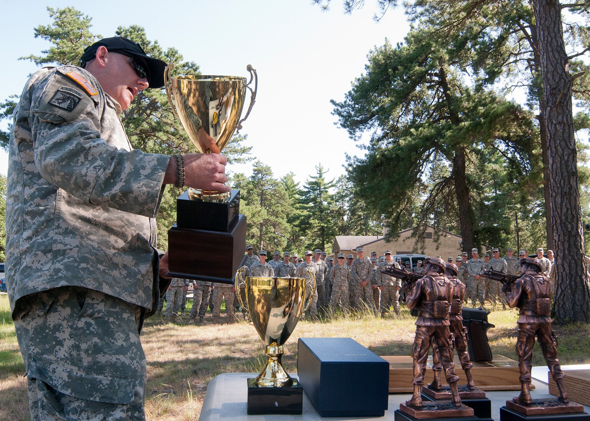 FORT DEVENS, Mass. – New Hampshire Army National Guard Maj. David Fink prepares to announce the state’s top gun competitors to members of the N.H. National Guard here Aug. 25. Airmen and soldiers vied for coveted slots on the N.H. Combat Squad, to compete at the New England Warrior Challenge and the National Guard Marksmanship Advisory Council Region 1. (N.H. National Guard photo by Tech. Sgt. Mark Wyatt/Released)