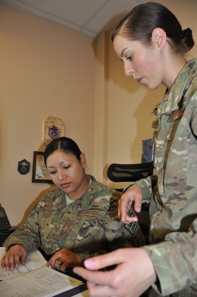 Tech. Sgt. Karina Myers, 455th Air Expeditionary Wing financial management NCO, deployed from Dyess Air Force Base, Texas, and a native of Houston, works with Staff Sgt. Margaret Prokop, 455th AEW/FM budget technician, deployed from Nellis Air Force Base, Nev., and a native of Bolton, Conn, at Bagram Airfield, Afghanistan, Sept. 3. The 455th Air Expeditionary Wing finance management office not only provides financial customer service, it also plays an important role in the accomplishment of the 455 AEW mission by executing the wing budget to fund all mission requirements. (U.S. Air Force photo/Tech. Sgt. Rob Hazelett)