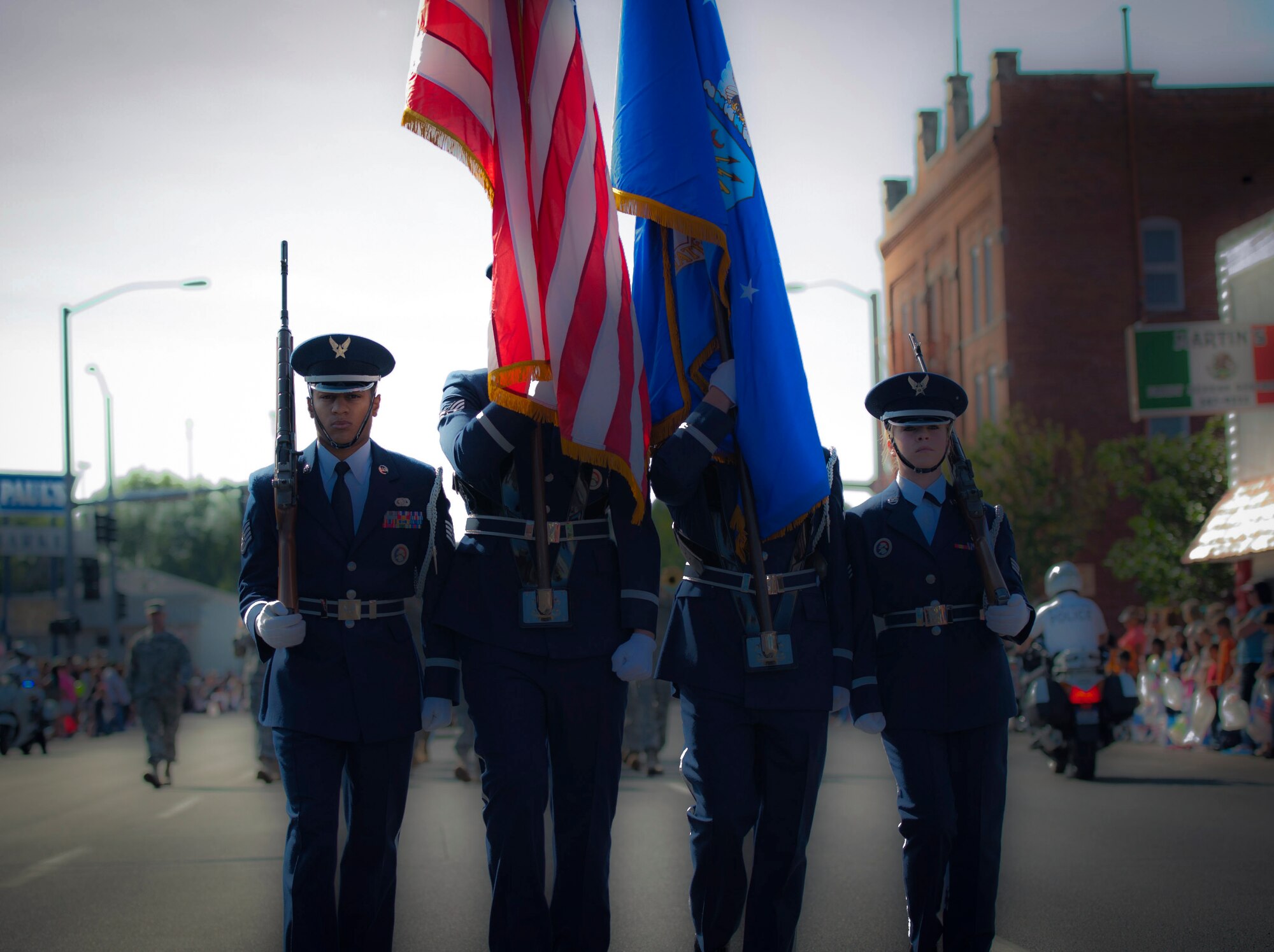 Four Mountain Home Air Force Base Honor Guard members march in the 2013 Air Force Appreciation Day parade in Mountain Home, Idaho, Sept. 7, 2013. The parade is the longest in Idaho, and this year marked the 53rd AFAD celebration. (U.S. Air Force photo illustration by Master Sgt. Kevin Wallace/RELEASED)