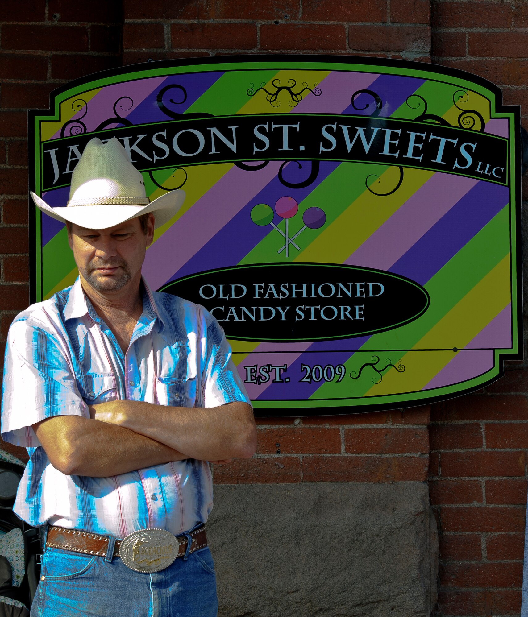 A local Mountain Home resident waits outside a candy store for the 2013 Air Force Appreciation Day parade to begin in Mountain Home, Idaho, Sept. 7, 2013. Downtown Mountain Home looks the part of a Hollywood small town and hosts the longest parade in Idaho annually, and this year marked the 53rd AFAD celebration. (U.S. Air Force photo by Master Sgt. Kevin Wallace/RELEASED)
