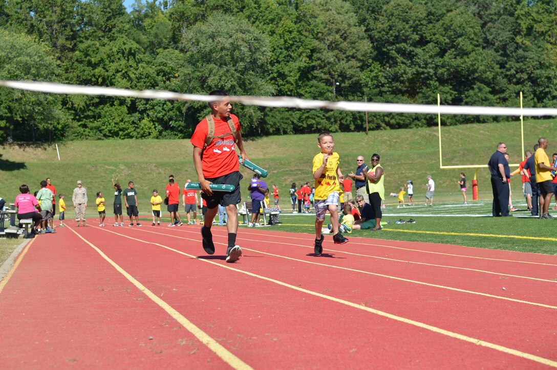 Participants run a portion of the Special Olympics track and field meet at Butler Stadium aboard Marine Corps Base Quantico on Sept. 7, 2013. Over 65 athletes participated in the event.