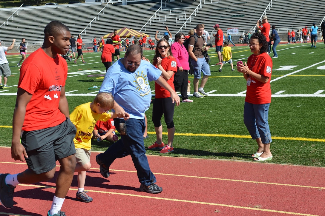 Participants run a portion of the Special Olympics track and field meet at Butler Stadium aboard Marine Corps Base Quantico on Sept. 7, 2013. Over 65 athletes participated in the event.