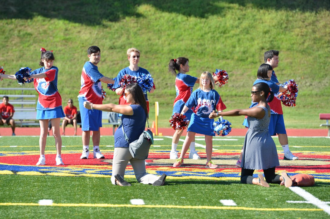 Cheerleaders bring motivation to the Special Olympics track and field meet aboard Marine Corps Base Quantico on Sept. 7, 2013. More than 65 athletes, ages five and up, participated in the event.