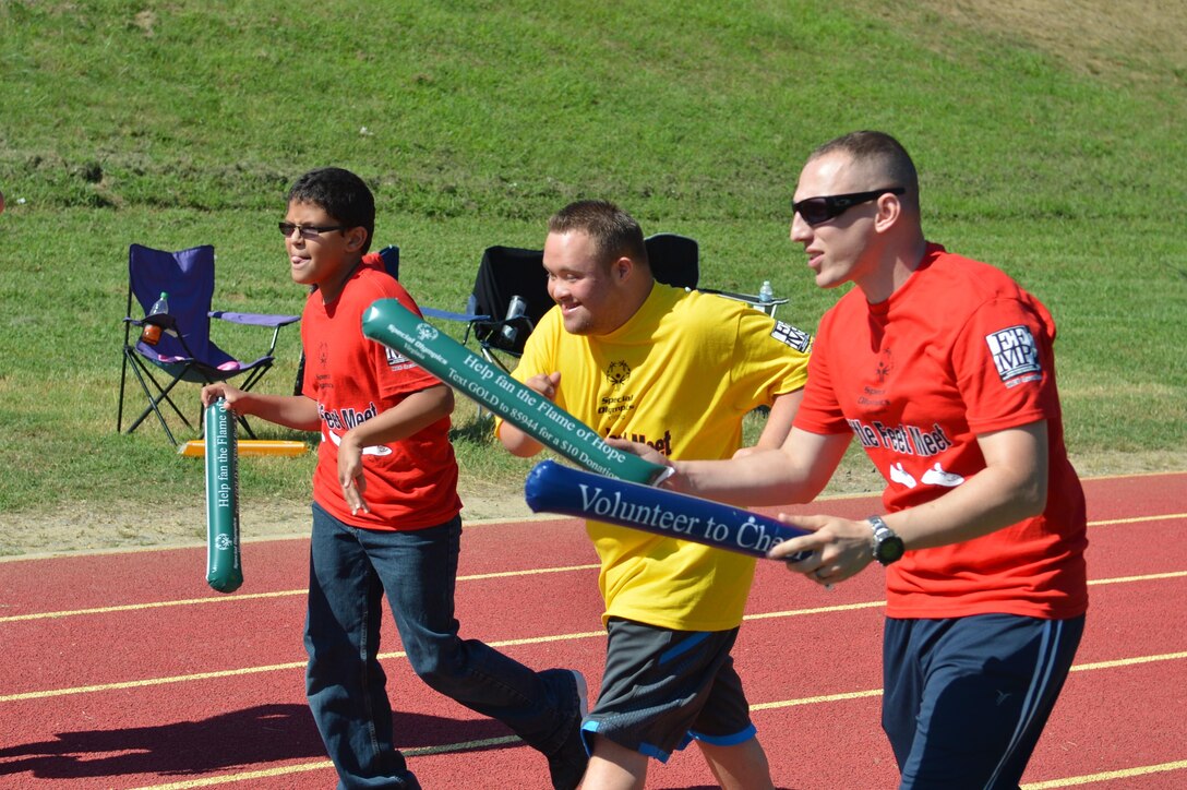 Participants run a portion of the Special Olympics track and field meet at Butler Stadium aboard Marine Corps Base Quantico on Sept. 7, 2013. Over 65 athletes participated in the event.