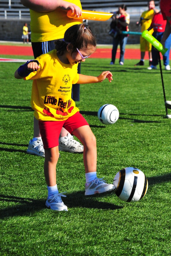 Brianna, 5, kicks a soccer ball during the Special Olympics track and field meet aboard Marine Corps Base Quantico on Sept. 7, 2013. Brianna was one of the over 65 athletes to participate in the event which was open to all families with special needs in the area.
