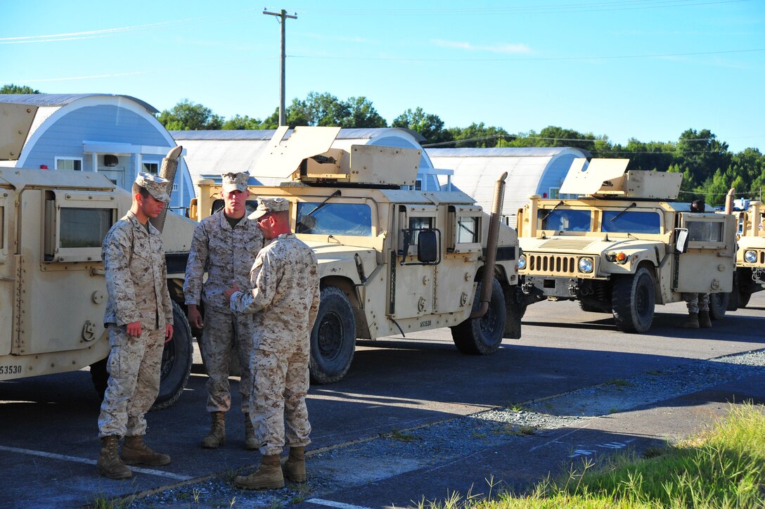 Marines discuss the plan of the day at the Reserve Support Unit aboard Marine Corps Base Quantico on Sept. 6, 2013. More than 50 Marines from the 1st Fleet Antiterrorism Security Team out of Norfolk, Va., were aboard Quantico to conduct training. 