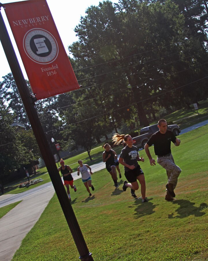 Staff Sgt. Matthew B. McGarvey, the staff noncommissioned officer-in-charge of Recruiting Substation Lexington, Recruiting Station Columbia, leads a group of Newberry College athletes during the first phase of the Sept. 7 Combat Fitness Test. The event focused on developing the athletes' physical fitness while emphasizing leadership principles. (Marine Corps photo by Sgt. Aaron Rooks)