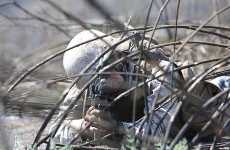 A Marine with Combat Logistics Battalion 5, 1st Marine Logistics Group, provides security during a combat operations center exercise aboard Camp Pendleton, Calif., Sept. 5, 2013. The COCEX requires Marines to rapidly set up, disassemble and displace command nodes in an expeditionary environment. 