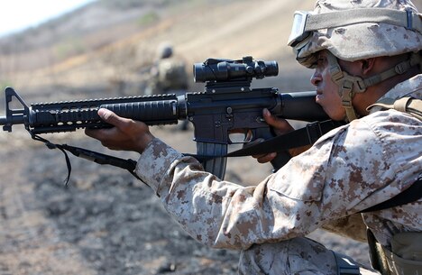 A Marine with Combat Logistics Battalion 5, 1st Marine Logistics Group, provides security during a combat operations center exercise aboard Camp Pendleton, Calif., Sept. 5, 2013. The COCEX requires Marines to rapidly set up, disassemble and displace command nodes in an expeditionary environment. 