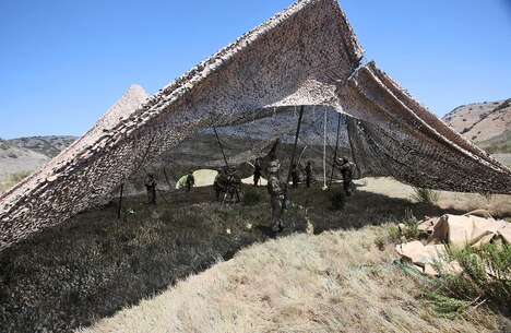 Marines with Combat Logistics Battalion 5, 1st Marine Logistics Group, set up a command center during a combat operations center exercise aboard Camp Pendleton, Calif., Sept. 5, 2013. The COCEX requires Marines to rapidly set up, disassemble and displace command nodes in an expeditionary environment. 