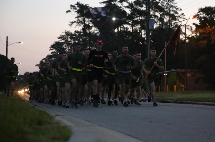 Marines with General Support Maintenance Company, 2nd Maintenance Battalion, 2nd Marine Logistics Group run in formation with Brendan O’Toole, the co-founder of the Run for Veterans, aboard Camp Lejeune, N.C., Sept. 4, 2013. The company ran in support of the program, which was founded to promote positive mental, physical and social wellbeing for veterans and their families. 