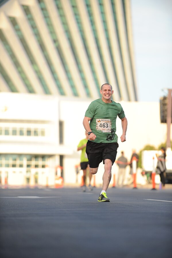 Daniel Machado, 30, Clinton Township, finishes the Crossroads 4-Miler hosted by the Marine Corps Marathon. The finish line was in front of the National Museum of the Marine Corps.