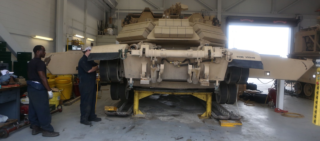 – An assault breaching vehicle is lifted in order to take it apart, so the body can be upgraded aboard Marine Corps Base Camp Lejeune, Sept. 5, 2013. The ABVs are being upgraded from an M1A1 Abrams Tank body frame to an M1A2, essentially making it a smoother ride for the crews inside.