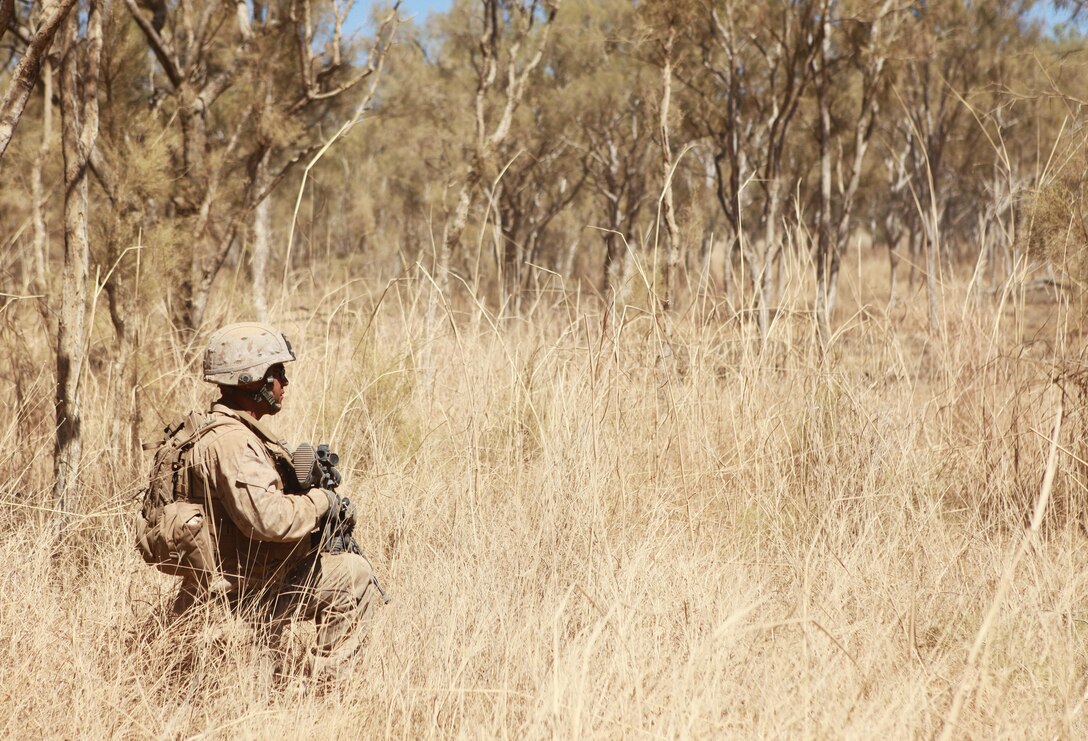 A Marine with Lima Company, 3rd Battalion, 3rd Marine Regiment, Marine Rotational Force - Darwin, waits to begin a movement-to-contact training evolution during Exercise Koolendong, here, Sept. 3. This training evolution is the first of its kind here in which Marines with MRF-D and the 31st Marine Expeditionary Unit worked bilaterally with the Australian soldiers of Bravo Company, 5th Battalion, Royal Australian Regiment as a "proof of concept" to assess the capacity of the training ranges to support a battalion-sized live-fire event.