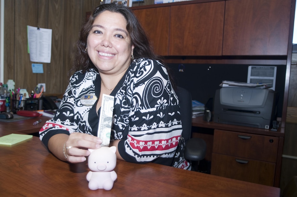 Jacqueline Walker is the new counselor for the Personal Financial Management Program at Marine Corps Base Hawaii. Walker, a Marine spouse, said there are dozens of resources available to service members and families to help them better manage their money to meet their goals. (U.S. Marine Corps photo by Christine Cabalo)