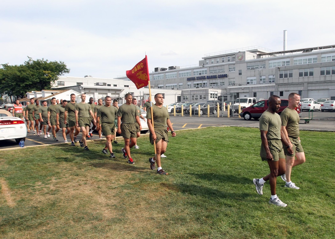 Sgt. Maj. Samuel Heyward Jr., the sergeant major of the 1st Marine Corps District, and Col. J. J. Dill, the 1MCD commanding officer, lead Marines of 1st Marine Corps District at the conclusion of a formation run Sept. 9.  The run was organized to enhance unit cohesion.