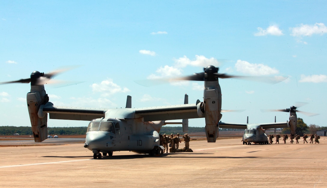 Marines with Marine Rotational Force - Darwin board two MV-22B Ospreys with Marine Medium Tiltrotor Squadron 265, 31st Marine Expeditionary Unit, here, Aug. 28. A total of four Ospreys flew the Marines to Bradshaw Field Training Area for Exercise Koolendong. During this exercise, Marines with MRF-D and the 31st MEU will work bilaterally with Australian soldiers from Bravo Company, 5th Battalion, Royal Australian Regiment.
