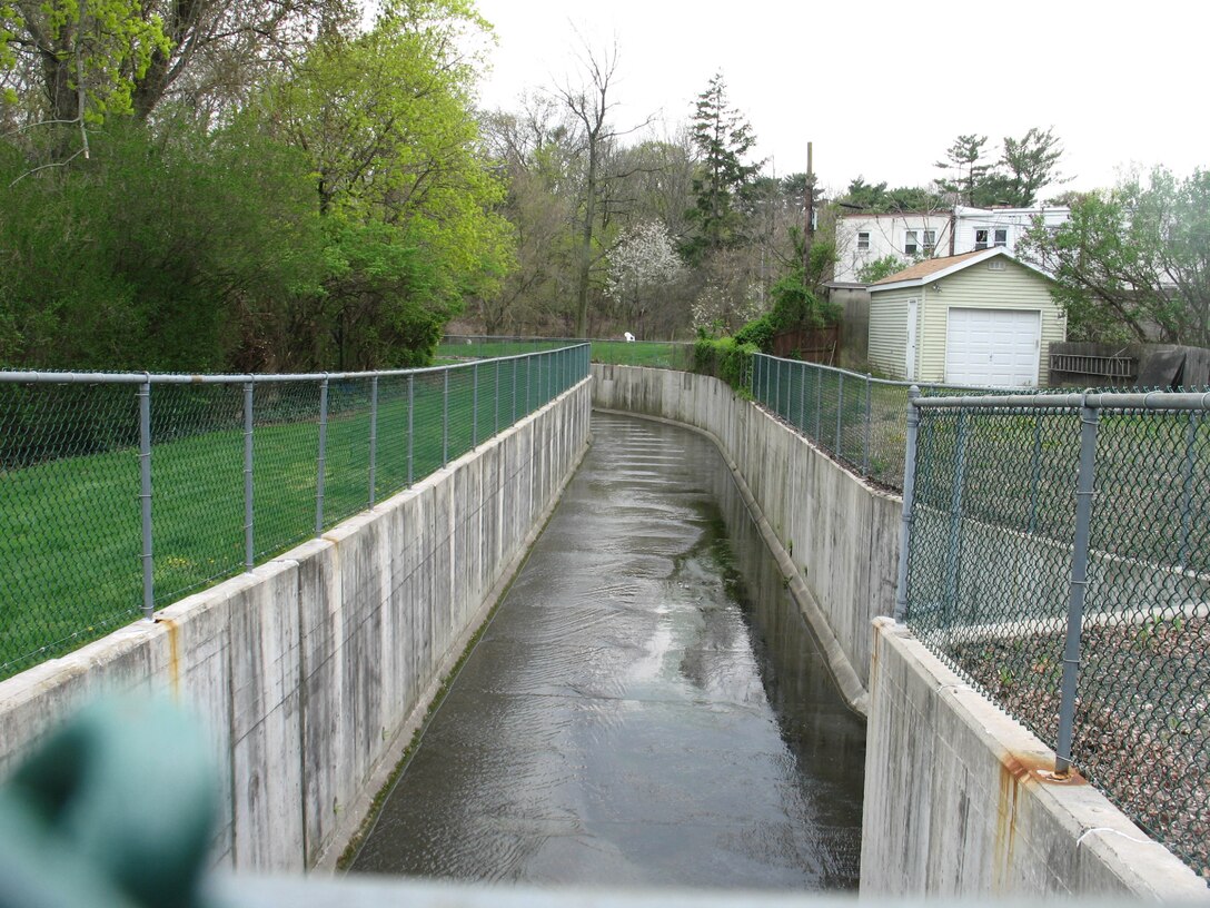 Portions of the creek are channelized in concrete flumes. This might appear to help the problem in one area, but only pushes the flooding problems downstream.

