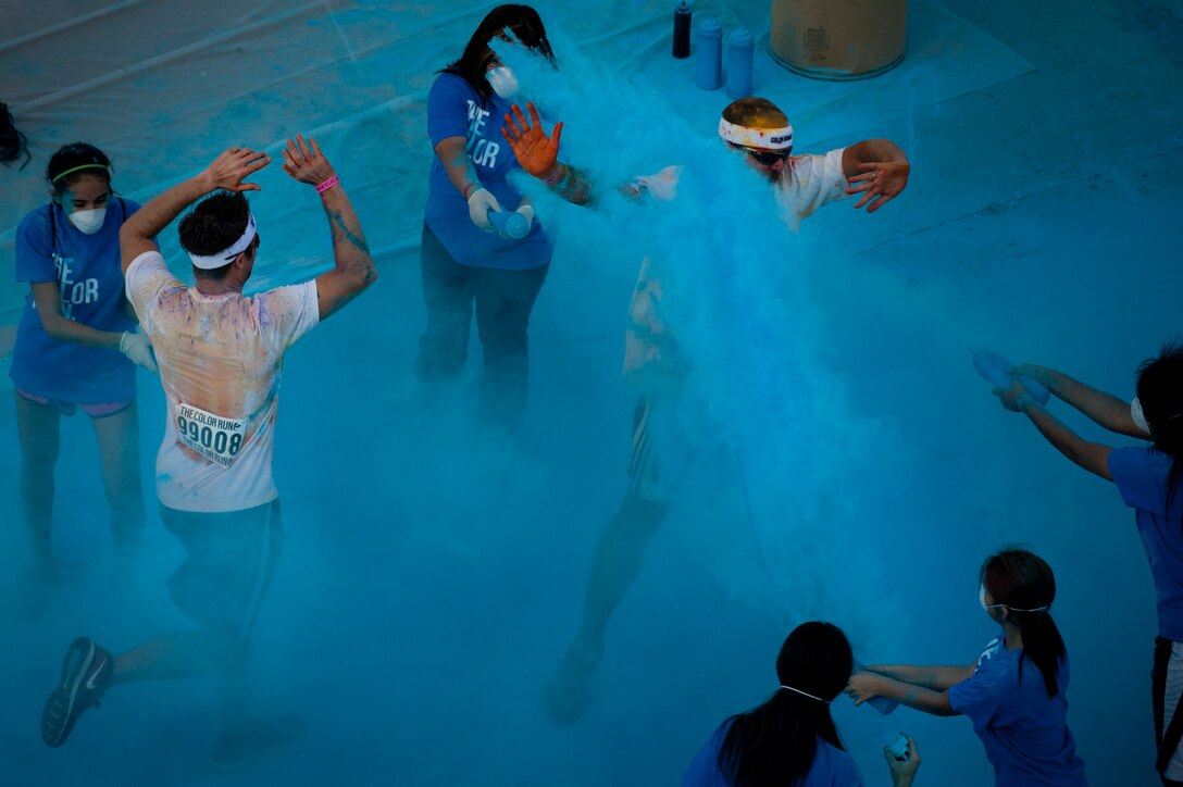 Airmen from Sheppard Air Force Base, Texas, get colorful with citizens of Wichita Falls during The Color Run, Sept. 7, 2013. There were more than 30 volunteers to help participants get colorful during five color zones.  (U.S. Air Force photo/Staff Sgt. Mike Meares) 