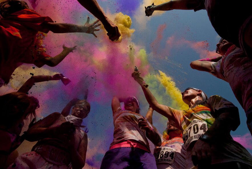 Airmen from Sheppard Air Force Base, Texas, get colorful with citizens of Wichita Falls during The Color Run, Sept. 7, 2013. There were more than 30 volunteers to help participants get colorful during five color zones.  (U.S. Air Force photo/Staff Sgt. Mike Meares) 