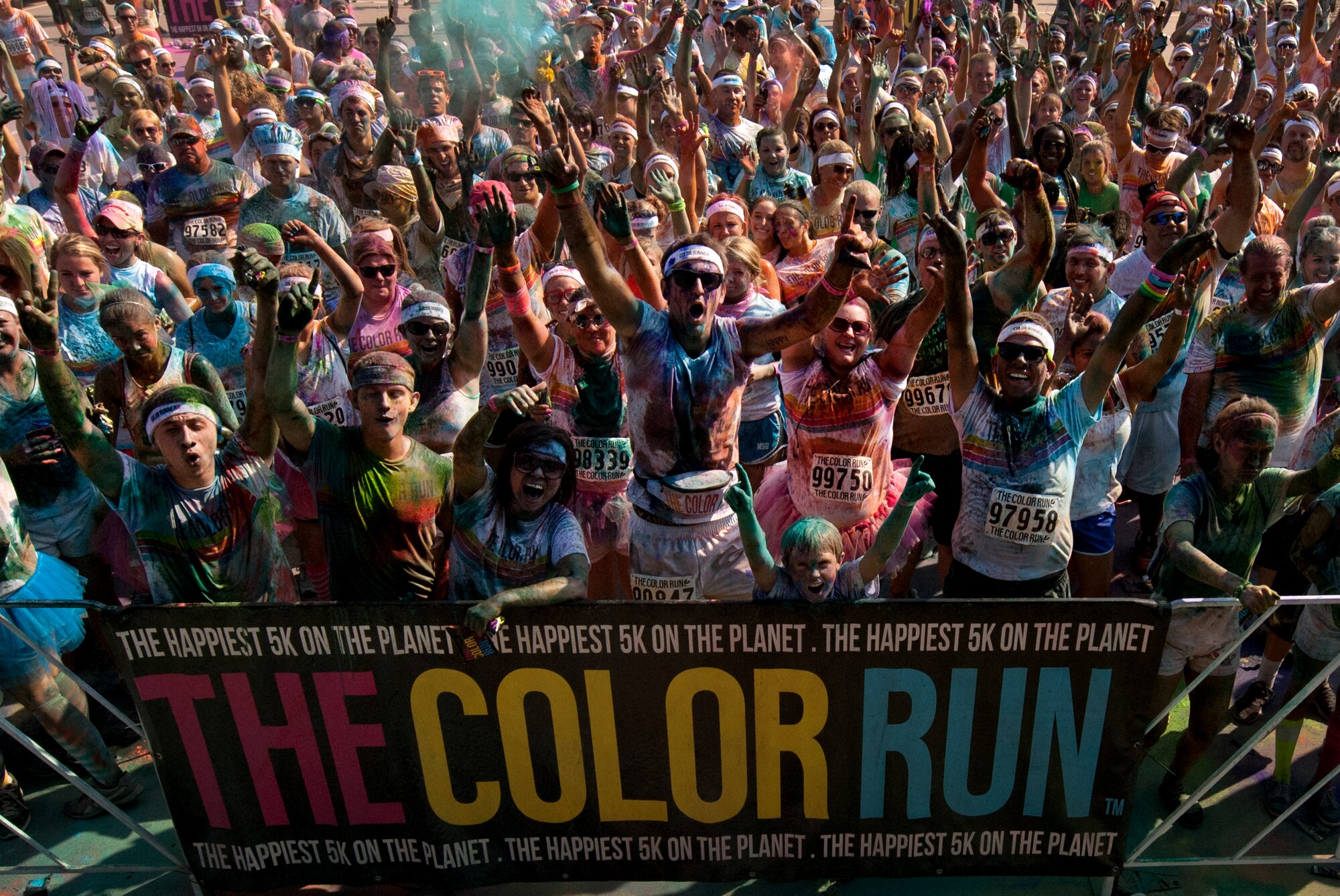 Airmen from Sheppard Air Force Base, Texas, get colorful with citizens of Wichita Falls during The Color Run, Sept. 7, 2013. There were more than 30 volunteers to help participants get colorful during five color zones.  (U.S. Air Force photo/Staff Sgt. Mike Meares) 