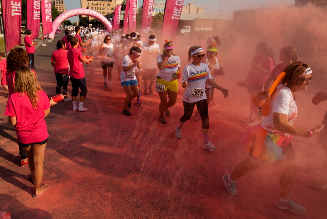 Airmen from Sheppard Air Force Base, Texas, get colorful with citizens of Wichita Falls during The Color Run, Sept. 7, 2013. There were more than 30 volunteers to help participants get colorful during five color zones.  (U.S. Air Force photo/Staff Sgt. Mike Meares) 