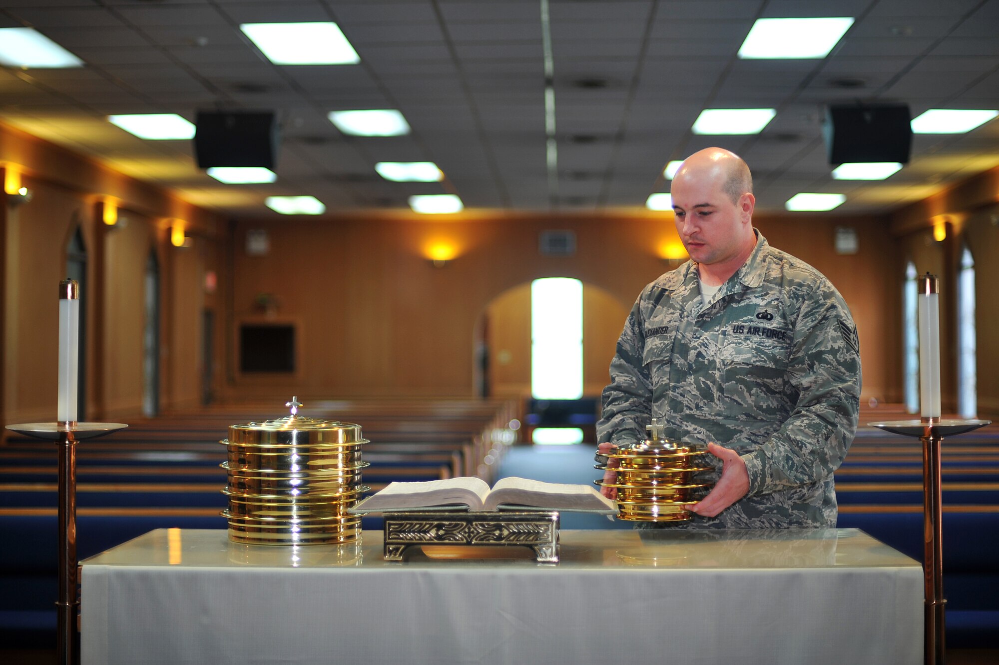 Staff Sgt. Darick Alexander, 51st Fighter Wing NCO in charge of Chapel logistics, sets up for communion before a Protestant service at Osan Air Base, Republic of Korea, Sept. 5, 2013. Alexander is this week’s Airman Spotlight winner. (U.S. Air Force photo/Staff Sgt. Emerson Nuñez)