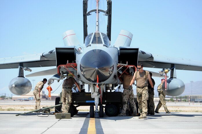 German air force aircraft maintainers assigned to the 33rd Fighter Bomber Wing, Buechel Air Base, Germany, perform post-flight inspections on a PA 200 Tornado after a training mission during a Green Flag-West exercise Sept. 5, 2013, at Nellis Air Force Base, Nev. Green Flag-West, in support of the U.S. Army's National Training Center, provides combat training to Coalition warfighters in the art of air-land integration and the joint employment of airpower. (U.S. Air Force Photo by Lorenz Crespo)