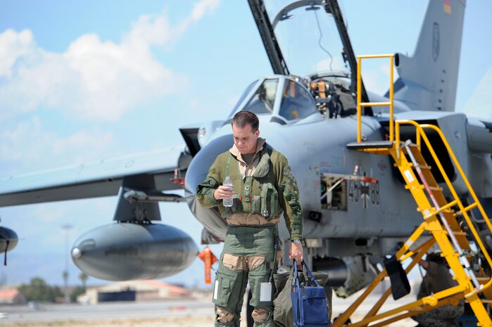 German air force Capt. Marcus Zlotos, 33rd Fighter Bomber Wing pilot, Buechel Air Base, Germany, rehydrates after a training mission during a Green Flag-West exercise Sept. 5, 2013, at Nellis Air Force Base, Nev. The 33rd FBW is participating in the two-week long exercise and testing various munitions on the U.S.  Army Combat Training Center at Fort Irwin, Calif. (U.S. Air Force Photo by Lorenz Crespo)