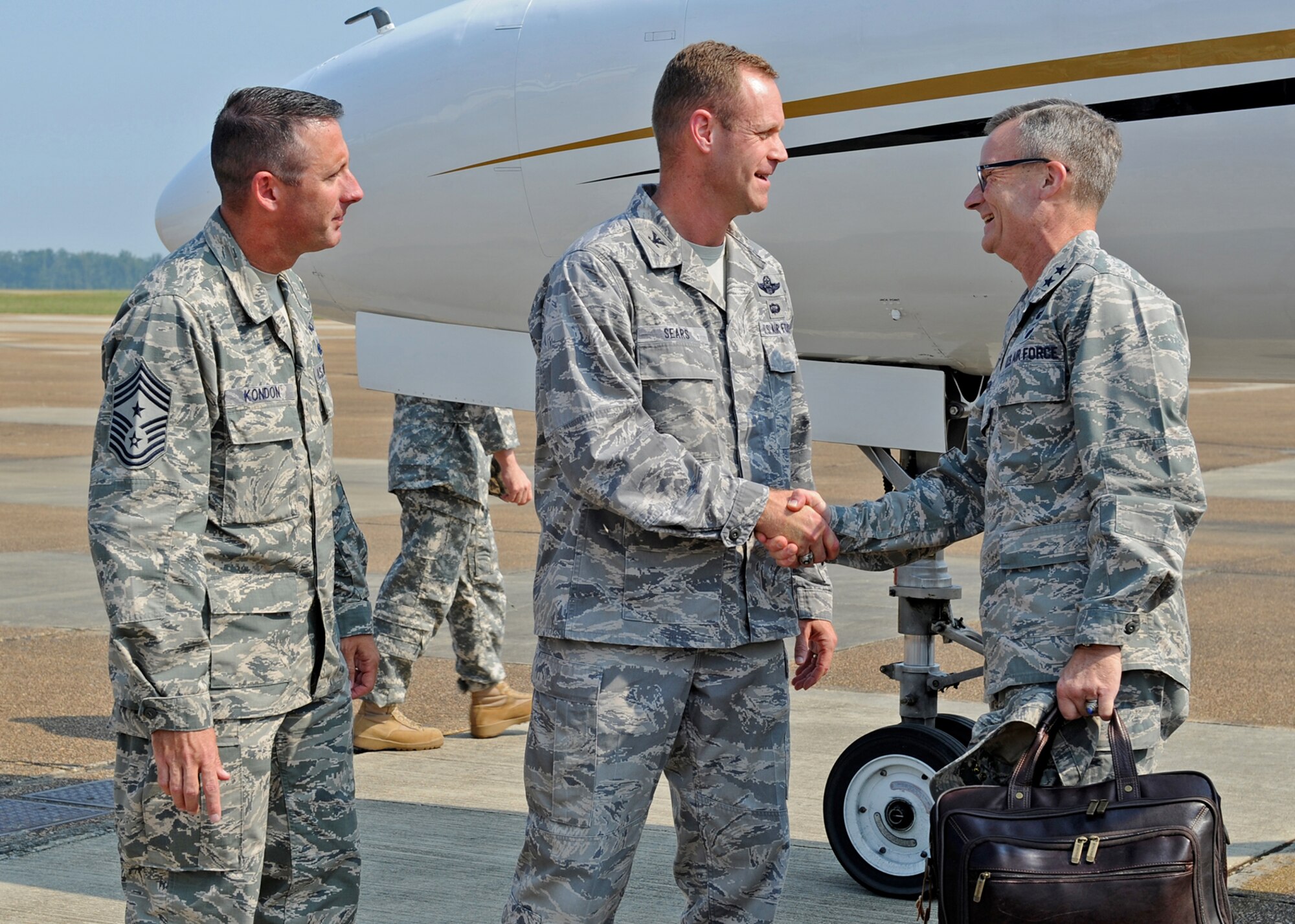 Col. Jim Sears, 14th Flying Training Wing Commander and Chief Master Sgt. Vance Kondon, 14th FTW Command Chief greet Maj. Gen. Steven Lepper, Deputy Judge Advocate General upon arrival at Columbus Air Force Base Sept. 9.  Lepper and Chief Master Sgt. Steven Wallace, Senior Paralegal Manager to The Judge Advocate General are visiting Columbus to conduct part-two of the 14th FTW JA Article 6 Inspection.  (U.S. Air Force Photo)
